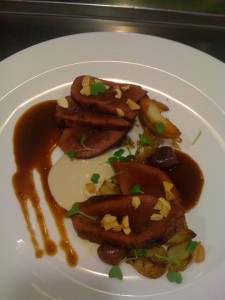 Pan Roasted Venison with bing cherries, cashews, roasted potatoes, pearl onions, and dijon glaze